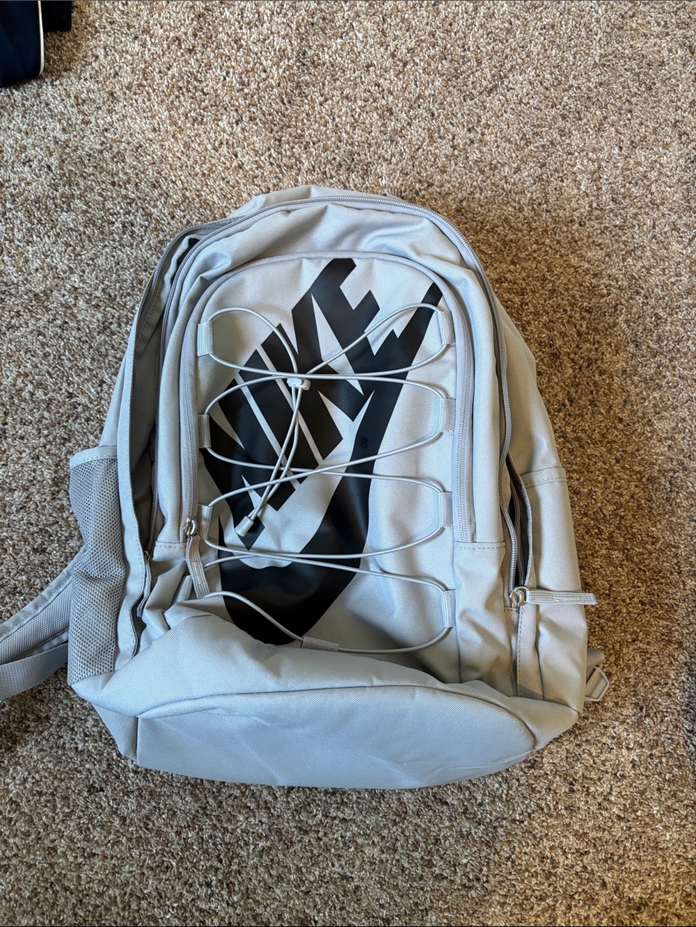Nike Light Gray Backpack with Black Swoosh Graphic